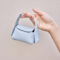 Sky Mini Drippy AirPods Case made of full-grain leather with stainless steel hardware