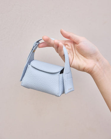 Sky Mini Drippy AirPods Case made of full-grain leather with stainless steel hardware