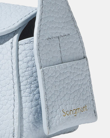 Sky blue Mini Drippy AirPods Case with textured leather and gold Songmont logo