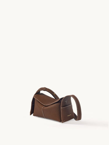 Mini Drippy Roof Bag in chocolate brown textured leather with white stitching and top handle.