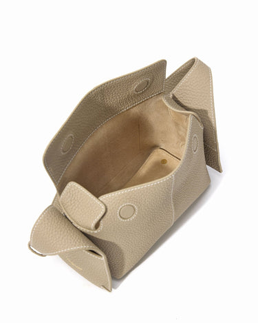 Mini Drippy Roof Bag in Cobble textured leather, showcasing structured interior and architectural design elements.