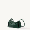 Emerald green Mini Drippy Roof Bag with textured leather and white stitching