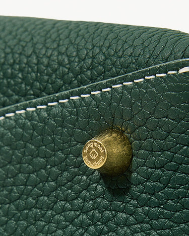 Mini Drippy Roof Bag in Emerald green full-grain leather with embossed Songmont logo stud and stitching.