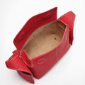 Red full-grain leather Mini Drippy Roof Bag with stainless steel hardware and white stitching