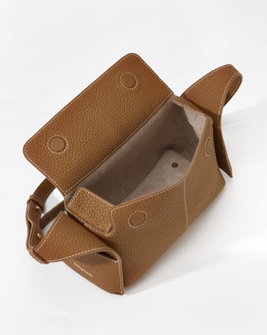 Mini Drippy Roof Bag in Mocha, made of full-grain leather with white stitching and a structured yet soft silhouette.