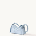 Pale blue full-grain leather mini drippy roof bag with stainless steel hardware and adjustable strap.
