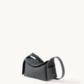 Mini Drippy Roof Bag in Stardust pebbled leather, structured rectangular shape with flap closure and top handle.