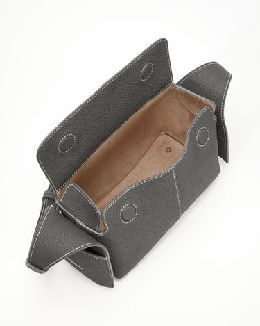 Mini Drippy Roof Bag in stardust pebbled leather with white stitching and sheepskin lining.
