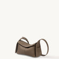 Mini Drippy Roof Bag in taupe pebbled leather with white stitching and a curved strap.