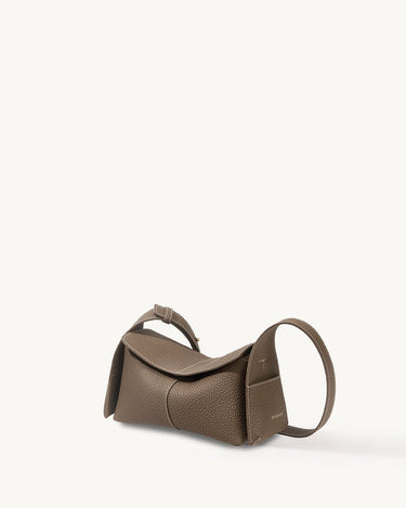 Mini Drippy Roof Bag in taupe pebbled leather with white stitching and a curved strap.