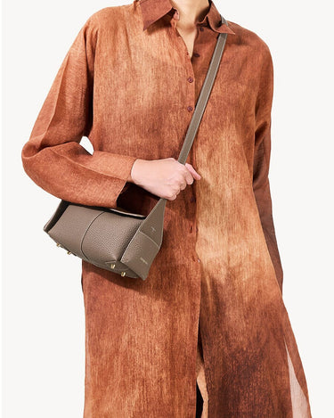 Taupe Mini Drippy Roof Bag: textured leather, gold hardware, unique architectural design.