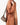 Taupe Mini Drippy Roof Bag on a woman wearing a textured brown shirt. Pebbled leather handbag with flap closure.