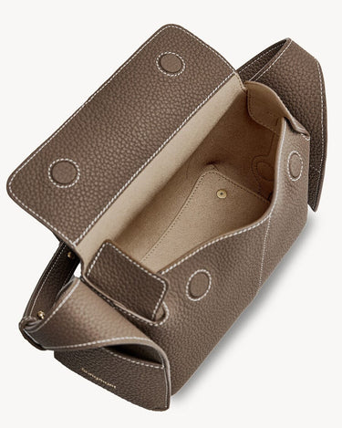 Taupe Mini Drippy Roof Bag with open flap showing interior and white stitching.