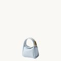 Pale blue Mini Song AirPods case in textured leather with gold hardware.