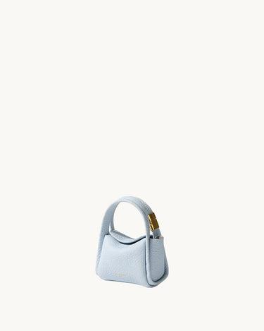 Pale blue Mini Song AirPods case in textured leather with gold hardware.