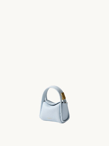 Pale blue Mini Song AirPods case in textured leather with gold hardware.