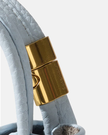 Sky Mini Song AirPods Case with gold hardware and Songmont logo.