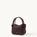 Burgundy mini Songmont leather bag with dual handles and gold feet