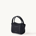 Mini Song Bag in Onyx black full-grain leather with gold embossed logo and hardware.