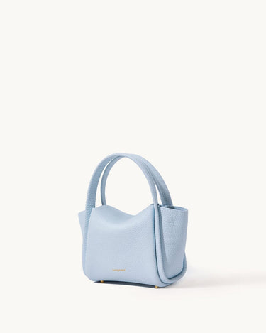 Light blue pebbled leather Mini Song Bag with rounded handles and gold feet