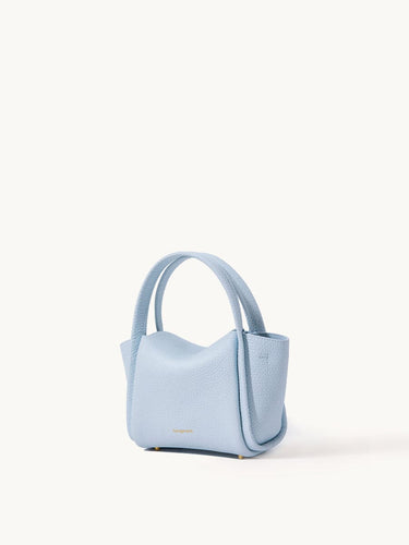 Light blue pebbled leather Mini Song Bag with rounded handles and gold feet