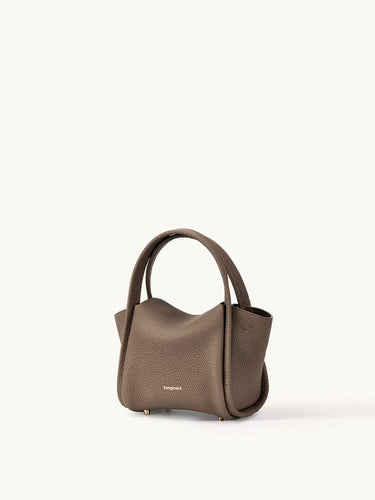 Taupe pebble-grain leather Mini Song Bag with gold embossed logo and top handles.