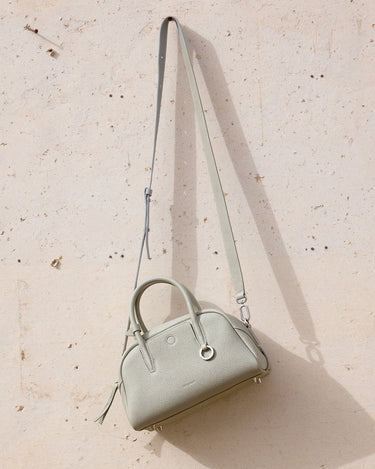 Mini Yore Bowling Bag in Celeste: textured full-grain leather with silver hardware and detachable strap.