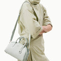 Mini Yore Bowling Bag in Celeste full-grain leather with silver hardware and adjustable strap.
