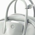 Mini Yore Bowling Bag in Celeste full-grain leather with textured finish, detailed stitching, and gold-tone hardware.