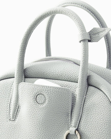Mini Yore Bowling Bag in Celeste full-grain leather with textured finish, detailed stitching, and gold-tone hardware.