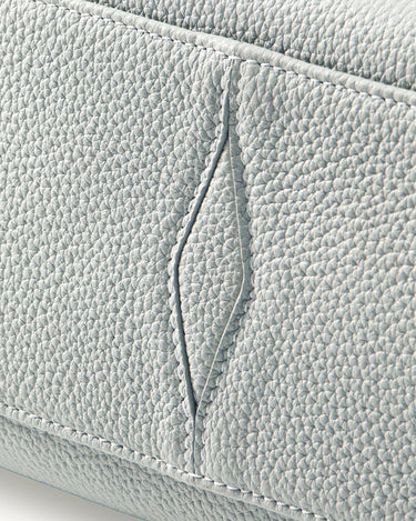 Close-up of Celeste Mini Yore Bowling Bag full-grain leather with visible stitching and textured detail.