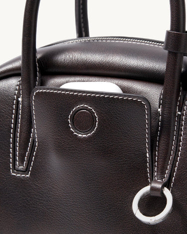 Ebony Mini Yore Bowling Bag: Full-grain nappa leather, white stitching, silver hardware details.