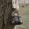 Mini Yore Bowling Bag in ebony pebbled leather with decorative beads and 'Songmont' logo.