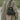 Ebony Mini Yore Bowling Bag in full-grain leather, white stitching, silver hardware, worn with taupe trench coat.