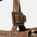 Mini Yore Duffle Bag in Sandal brown leather with detailed white stitching and stud closure
