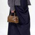 Mini Yore Duffle Bag in Sandal, vegetable-tanned leather with gold hardware. Chic travel bag.