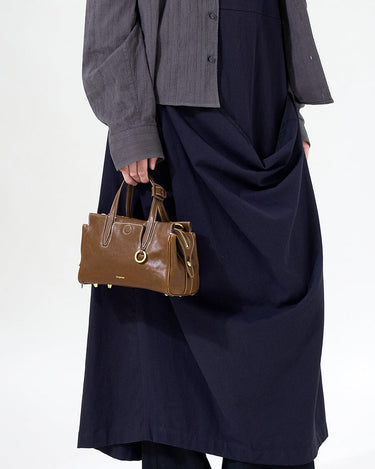Mini Yore Duffle Bag in Sandal, vegetable-tanned leather with gold hardware. Chic travel bag.
