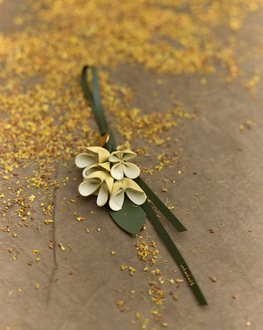 Osmanthus Charm leather accessory designed as a flower, crafted with handmade techniques.