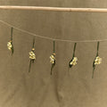 Osmanthus Charm in full-grain leather, detailed with handmade floral design and golden bead.