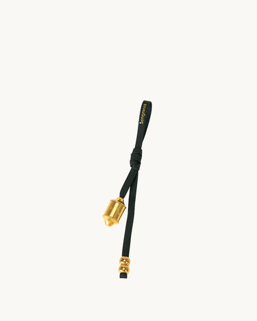 Onyx Prayer Wheel Charm with gold-tone hardware and Songmont logo on black leather strap.