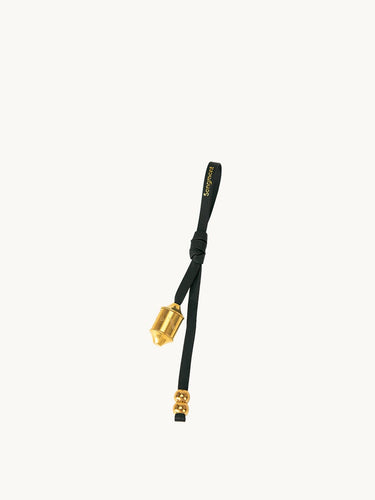 Onyx Prayer Wheel Charm with gold-tone hardware and Songmont logo on black leather strap.