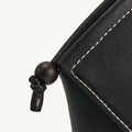 Onyx Prism Airpods Case with leather stitching and wooden bead detail