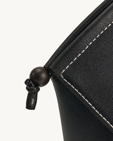 Onyx Prism Airpods Case with leather stitching and wooden bead detail