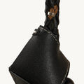 Black leather Prism Seed Charm with a braided strap and metallic accent.