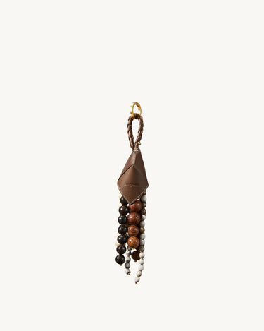 Songmont Prism Seed Charm accessory with brown leather, diverse beads, and gold hardware