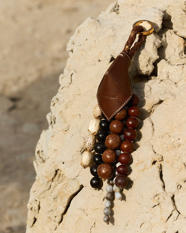 Songmont Prism Seed Charm with natural bodhi seeds and leather pouch