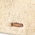 Songmont Shearling Gather Clutch Set in Amber, showcasing its soft shearling texture and leather logo tag.