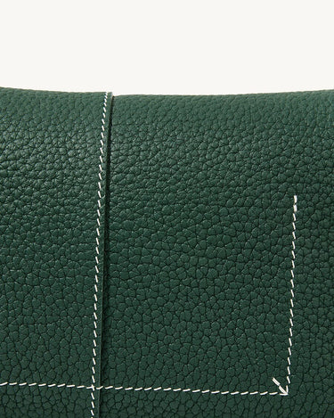 Small Drippy Roof Bag in textured dark green full-grain leather with white stitching detail.