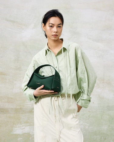 Small Drippy Roof Bag in deep green full-grain leather with microfiber lining and stainless steel hardware.