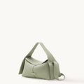 Small green pebbled leather crossbody bag with adjustable strap and gold embossed logo.